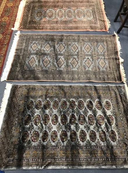 Three Pakistan Bokhara rugs 150 x 95cm, 155 x 95cm and 155 x 95cm